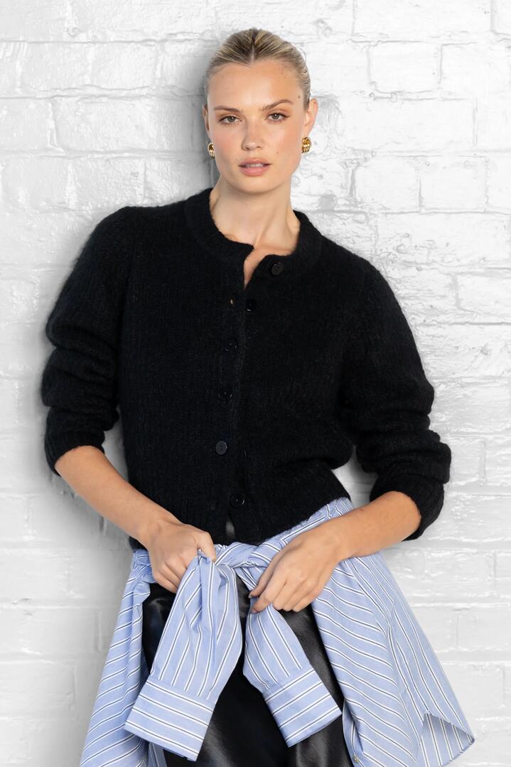 Image of a model wearing Outerwear. Product name - Highlight Black Mohair Blend Crewneck Cardigan in Black colour by brand - Ivy + Jack