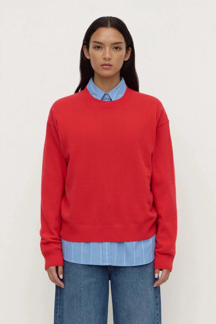 Image of a model wearing Outerwear. Product name - Carter Flame Brushed Merino Wool Sweater in Red colour by brand - Assembly Label