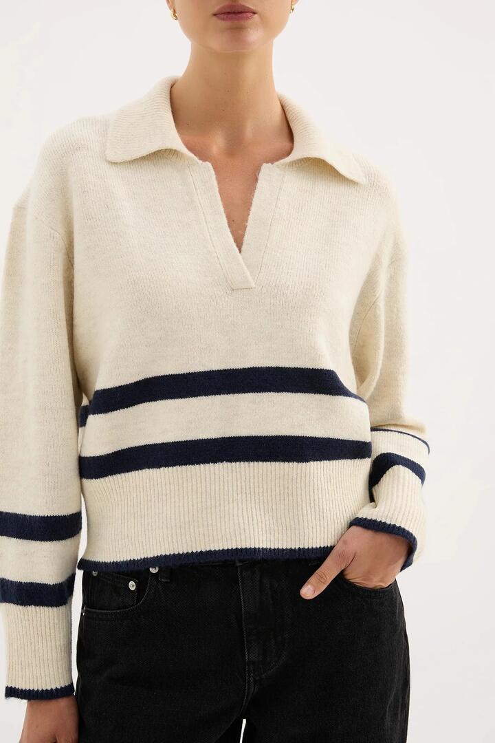 Image of a model wearing Outerwear. Product name - Archer Cream Stripe Collared Rugby Knit in Cream colour by brand - Nude Lucy