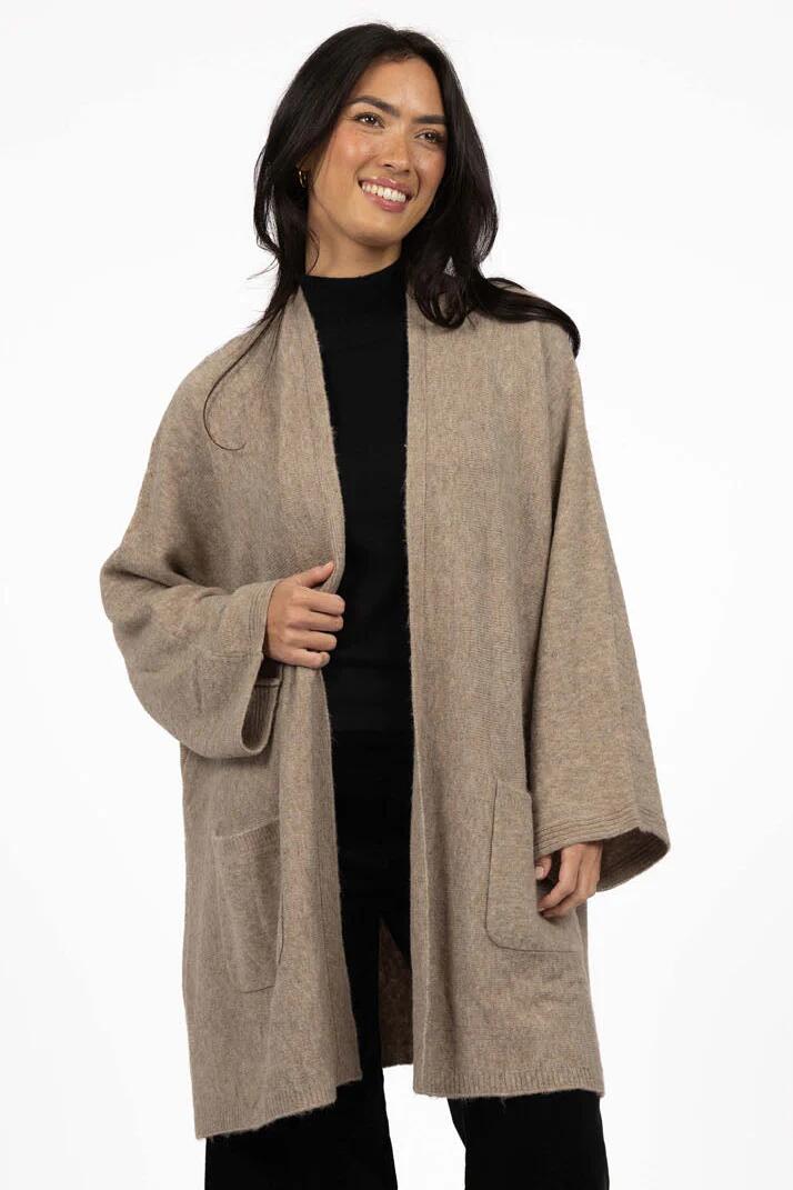 Image of a model wearing Outerwear. Product name - Rosha Hazelnut Relaxed Cardi in Natural colour by brand - Humidity Lifestyle