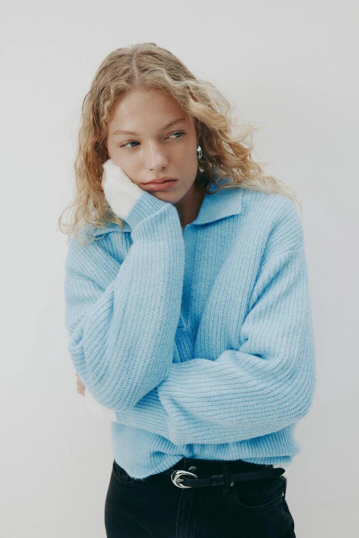 Image of a model wearing Outerwear. Product name - Coleen Horizon Blue Collared Rugby Knit in Blue colour by brand - Nude Lucy