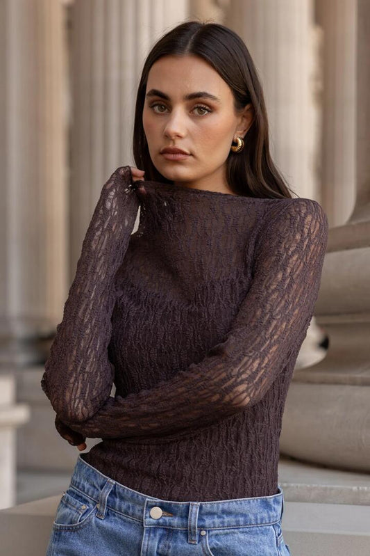 Image of a model wearing Tops. Product name - Giving Chocolate Lace Long Sleeve Top in Chocolate Lace colour by brand - Among the Brave