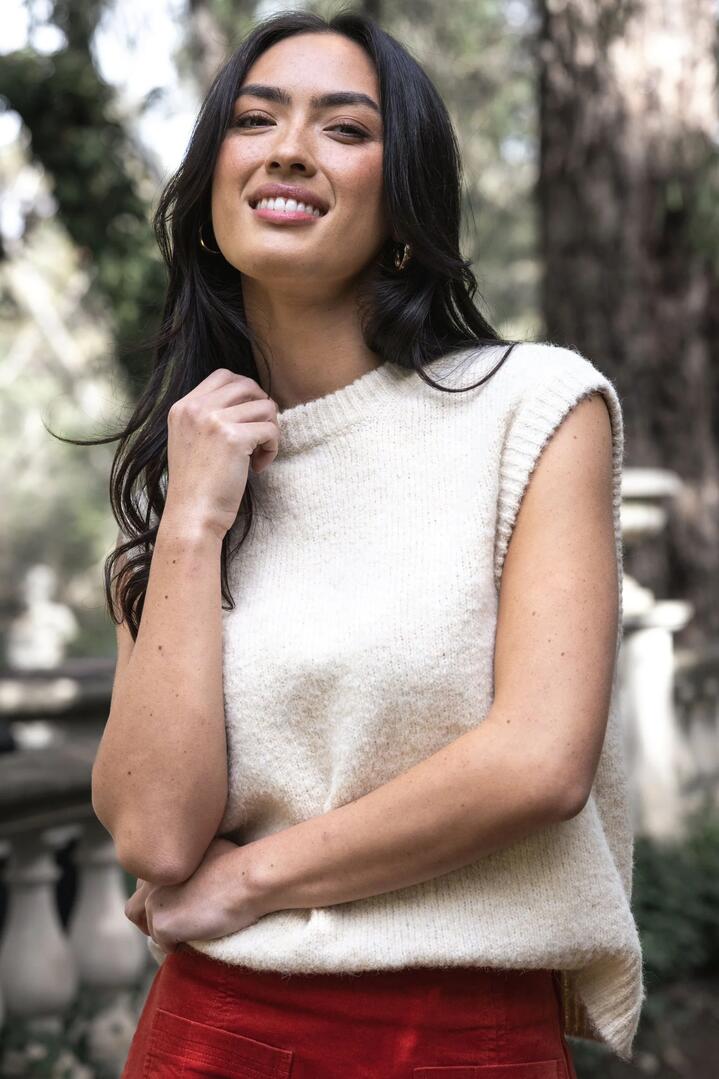 Image of a model wearing Outerwear. Product name - Monet Cream Wool Vest in Cream colour by brand - Humidity Lifestyle