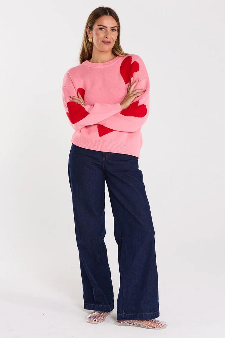 Image of a model wearing Outerwear. Product name - Love Pink Valentines Crew Knit in Pink colour by brand - Thing Thing