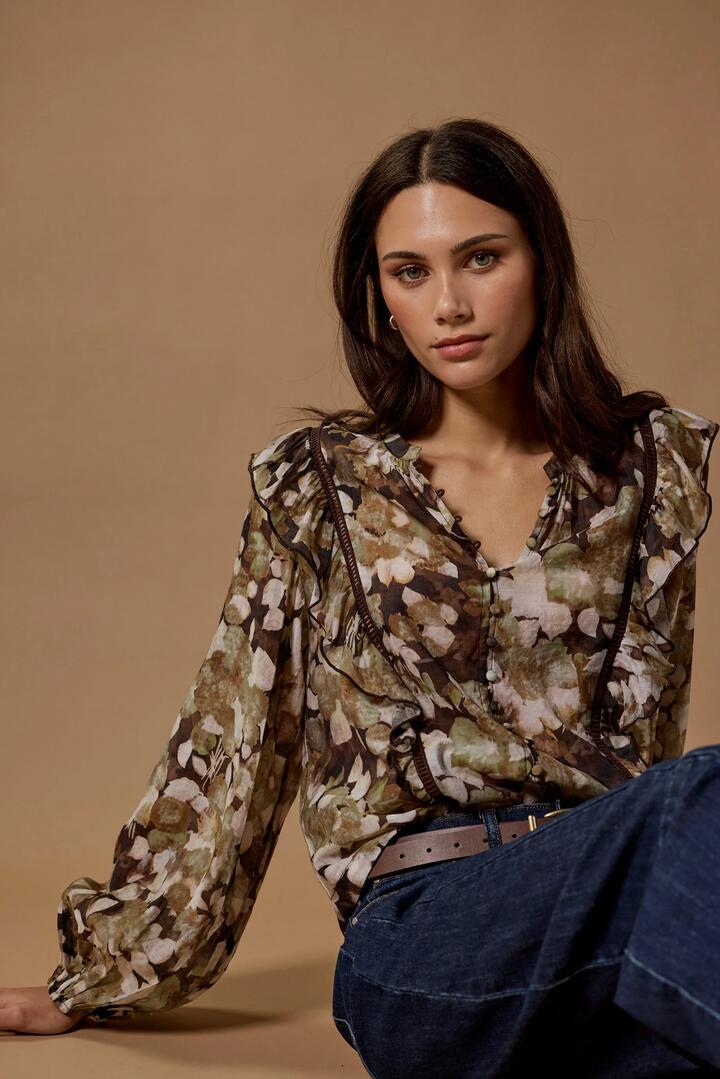 Image of a model wearing Tops. Product name - Integrity Brown Beige Floral Frill Detail Long Sleeve Top in Black Beige Floral colour by brand - Ivy + Jack
