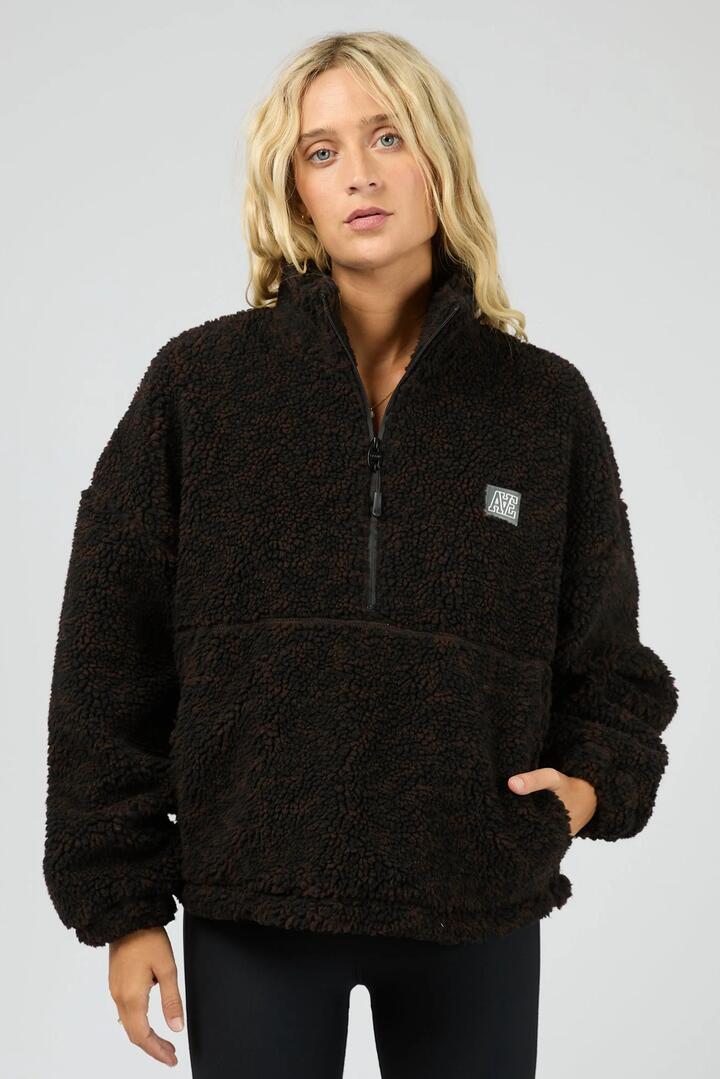 Image of a model wearing Outerwear. Product name - Into The Wild Leopard Quarter Zip Teddy Fleece Sweatshirt in Brown colour by brand - All About Eve