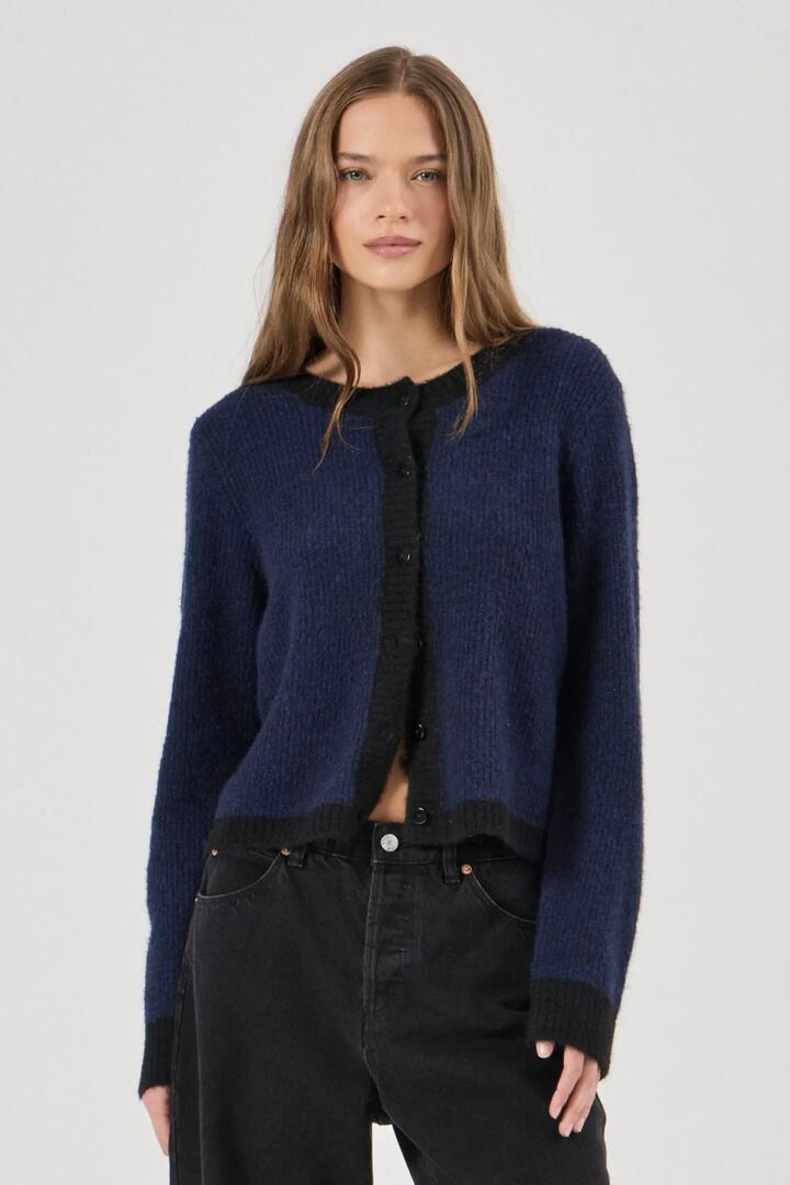 Image of a model wearing Outerwear. Product name - Eclipse Midnight Blue Border Cardigan in Blue colour by brand - Rollas