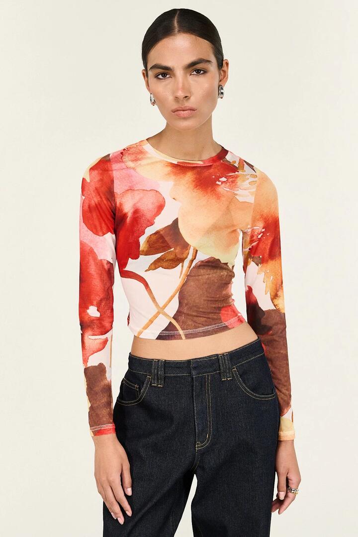 Image of a model wearing Tops. Product name - Kaia Red Abstract Floral Mesh LS Top in Red colour by brand - Staple The Label