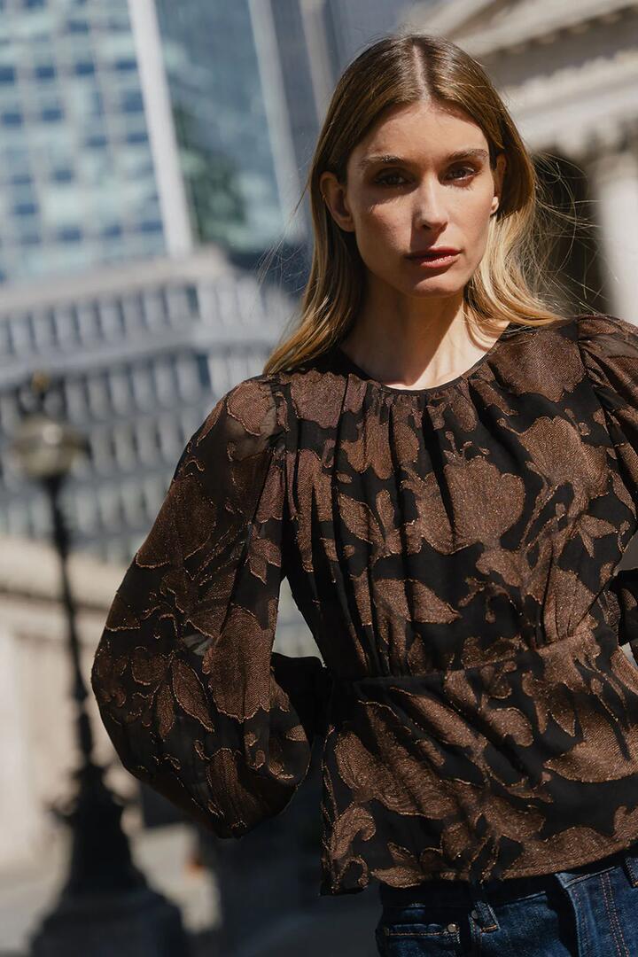 Image of a model wearing Tops. Product name - Beckon Chocolate Moonlit Garden Jacquard Bubble Sleeve Top in Moonlit Garden colour by brand - Georgia Zoe