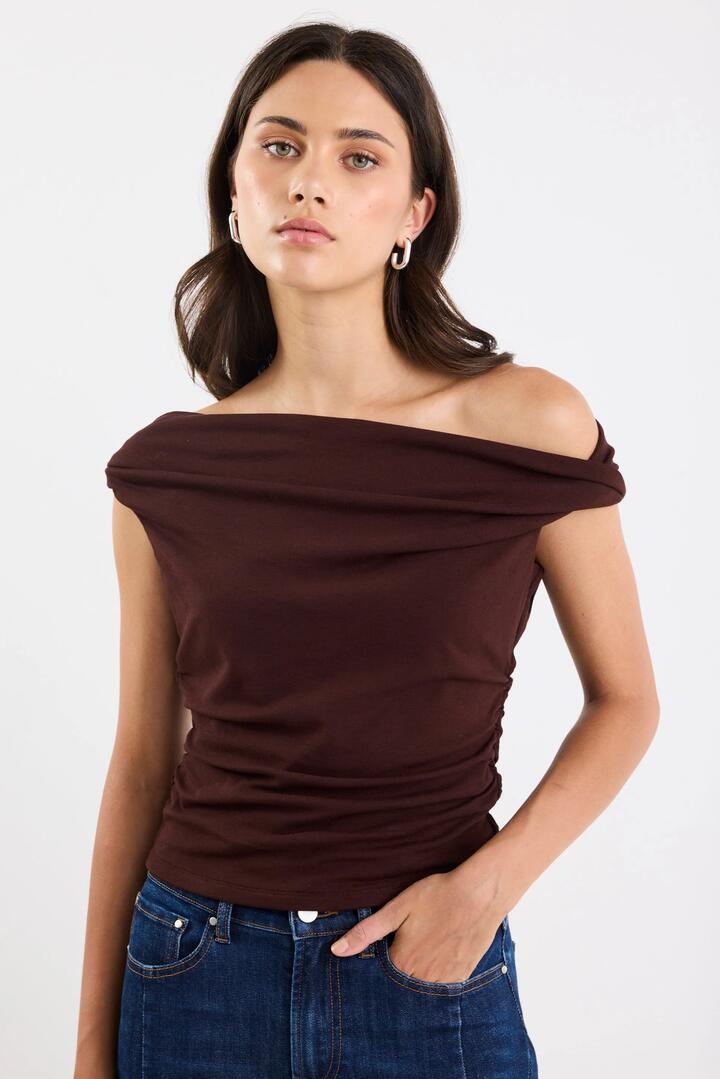 Image of a model wearing Tops. Product name - Nightlife Dark Chocolate Stretch Multi Fit Sleeveless Top in Dark Chocolate colour by brand - Stories be Told