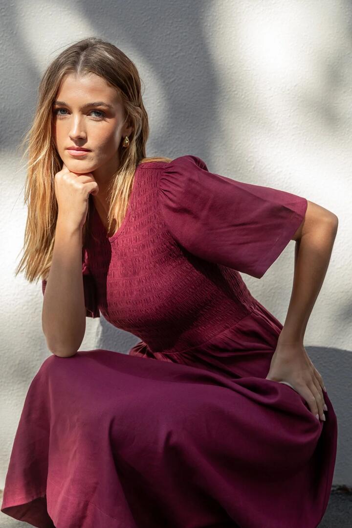 Image of Dresses. Product name - Wren Burgundy Plum SS Shirred Bodice Midi Dress in Burgundy Plum colour by brand - RE:UNION Label