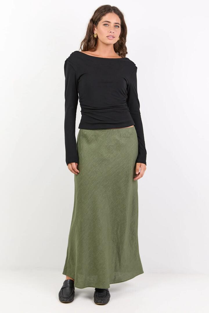 Image of a model wearing Skirts. Product name - Bliss Soft Khaki Linen Bias Midi Skirt in Soft Khaki colour by brand - RE:UNION Label