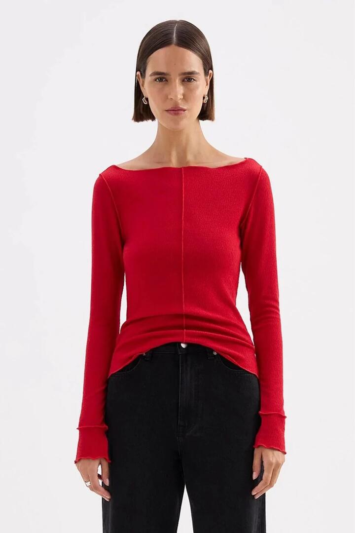 Image of a model wearing Tops. Product name - Ria Cherry Wide Neck LS Top in Red colour by brand - Nude Lucy