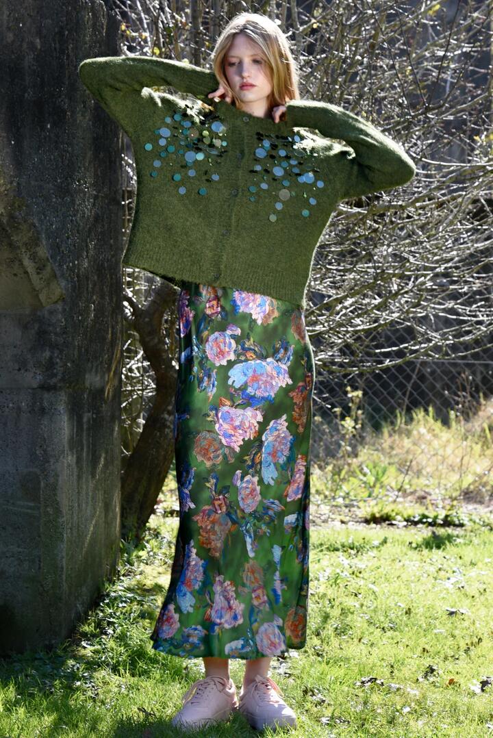 Image of a model wearing Skirts. Product name - Bias The Way Green Floral Maxi Skirt in Green colour by brand - Coop