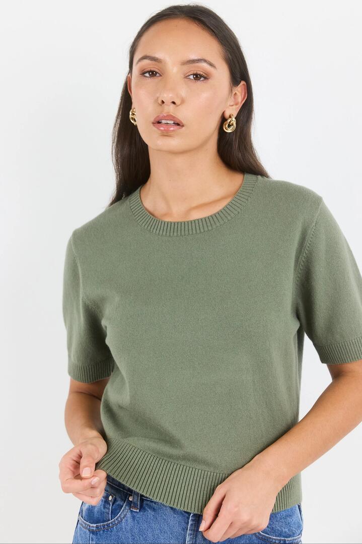 Image of a model wearing Outerwear. Product name - Topic Khaki Cashmere Blend Soft Knit Tee in Khaki colour by brand - Ivy + Jack