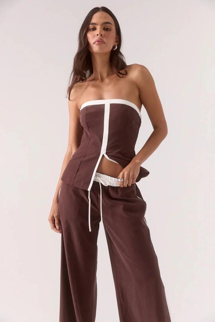 Image of a model wearing Tops. Product name - Sora Ganache Contrast Strapless Bodice Top in Brown colour by brand - Sovere