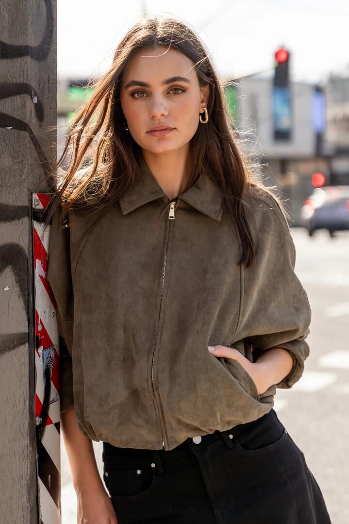 Image of Coats & Jackets. Product name - Troupe Khaki Faux Suede Zip Through Bubble Hem Bomber Jacket in Khaki colour by brand - Stories be Told