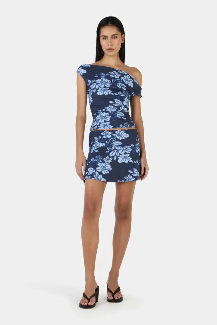 Image of a model wearing Skirts. Product name - Adriana Rolling Waves Blue Print Mini Skirt in Blue colour by brand - Ownley