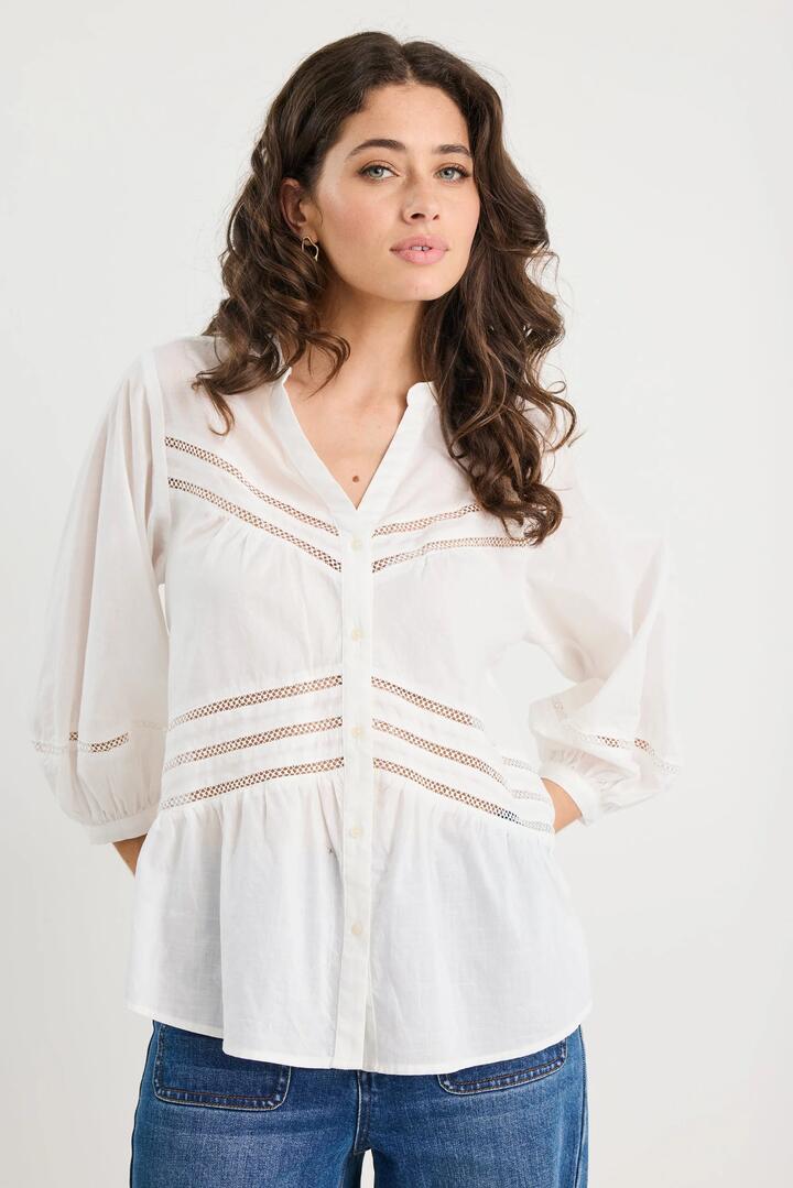 Image of a model wearing Tops. Product name - Astound Ivory Lace Trim SS Top in Ivory colour by brand - Ivy + Jack
