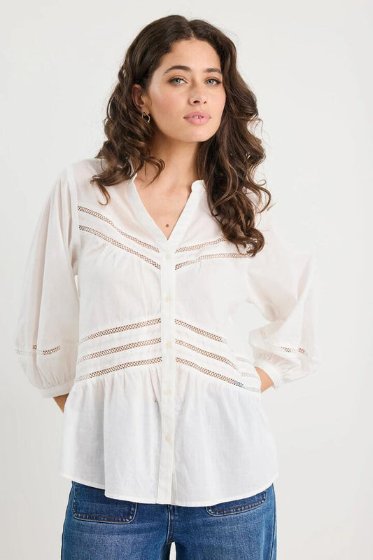 Image of a model wearing Tops. Product name - Astound Ivory Lace Trim SS Top in Ivory colour by brand - Ivy + Jack