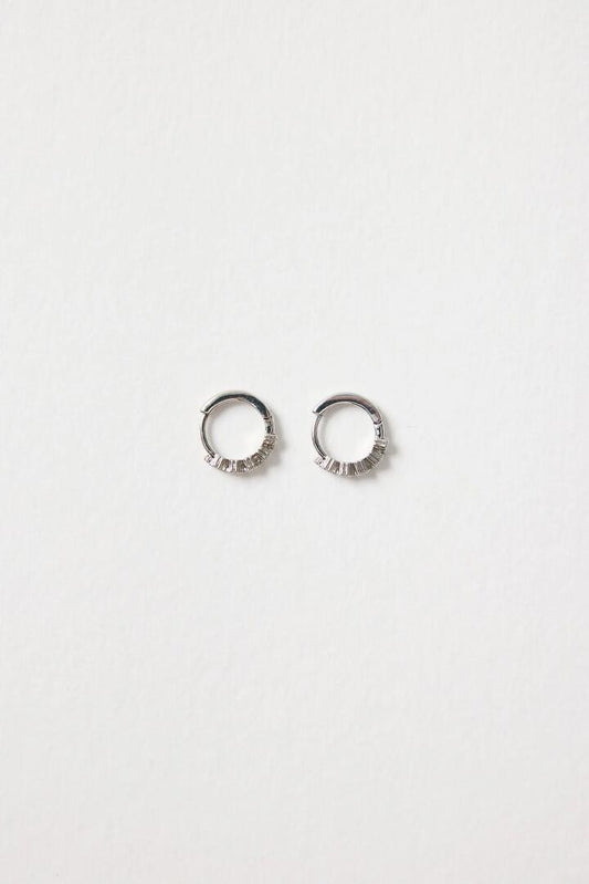 Image of Jewelry. Product name - Zig Zag Sparkle Rhodium Huggie in colour by brand - Humble + Heart