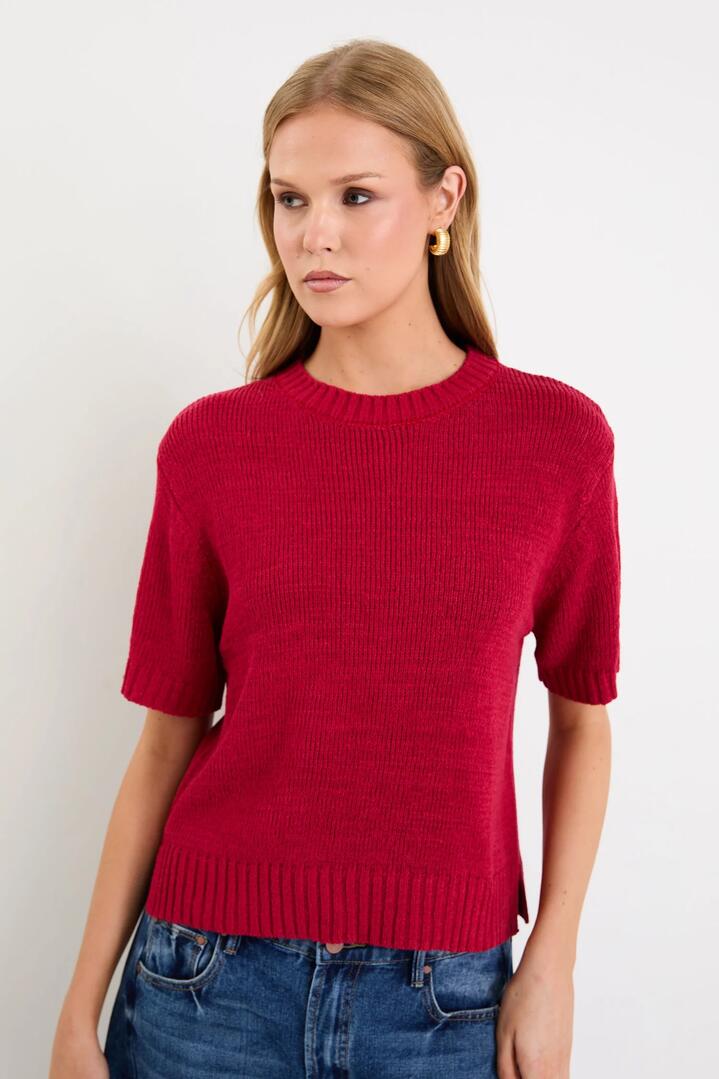 Image of a model wearing Outerwear. Product name - Loveable Cherry Tape Yarn Knit Tee in Cherry colour by brand - By Rosa.