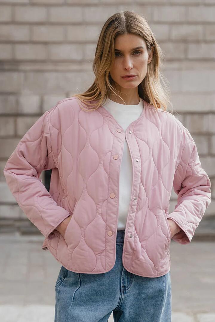 Image of Coats & Jackets. Product name - Apex Blush Collarless Quilted Puffer Jacket in Blush colour by brand - Stories be Told