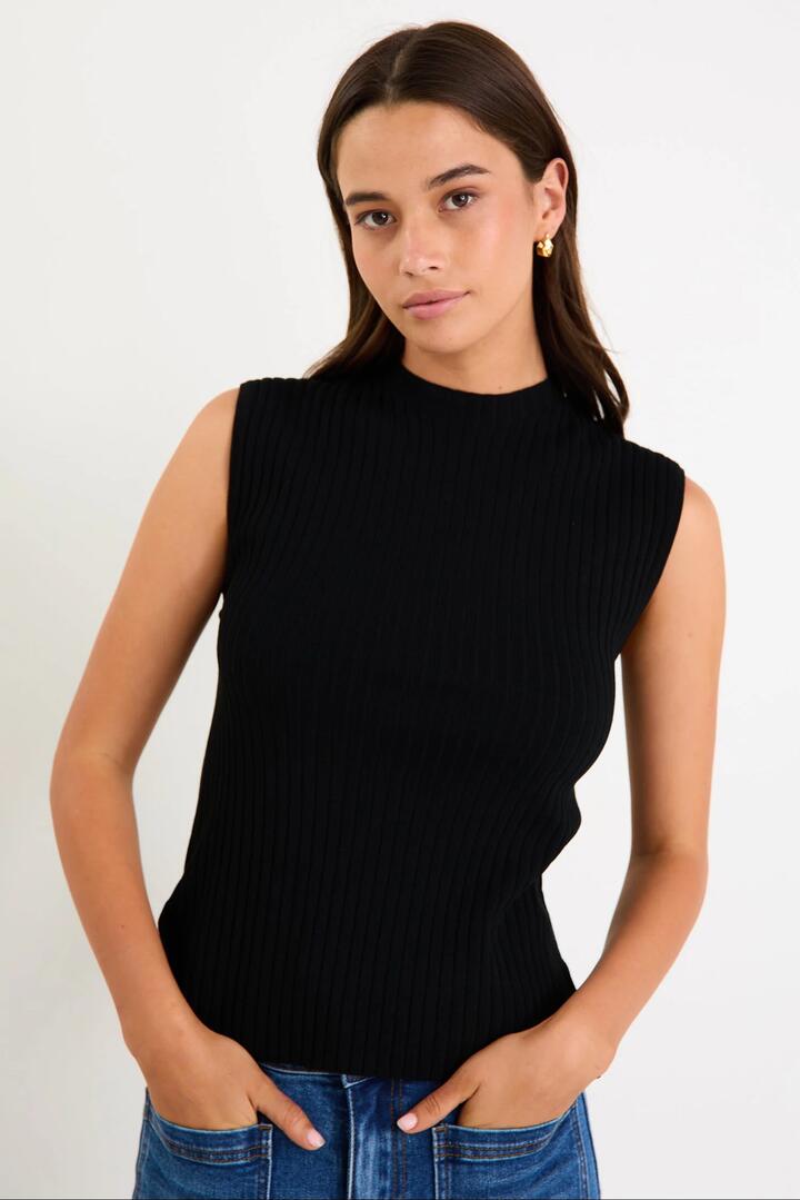 Image of a model wearing Outerwear. Product name - Heroic Black Sleeveless Funnel Neck Rib Knit Top in Black colour by brand - Among the Brave