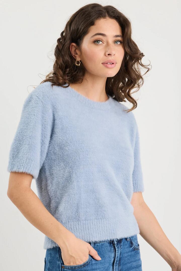 Image of a model wearing Outerwear. Product name - Issue Light Blue Fluffy Soft Knit Tee in Light Blue colour by brand - Ivy + Jack
