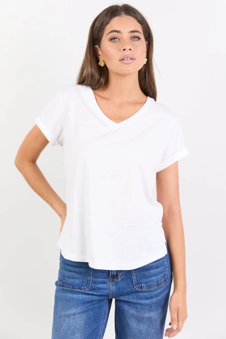 Image of a model wearing Tops. Product name - Rhyme White V Neck Short Sleeved Tee in White colour by brand - Among the Brave