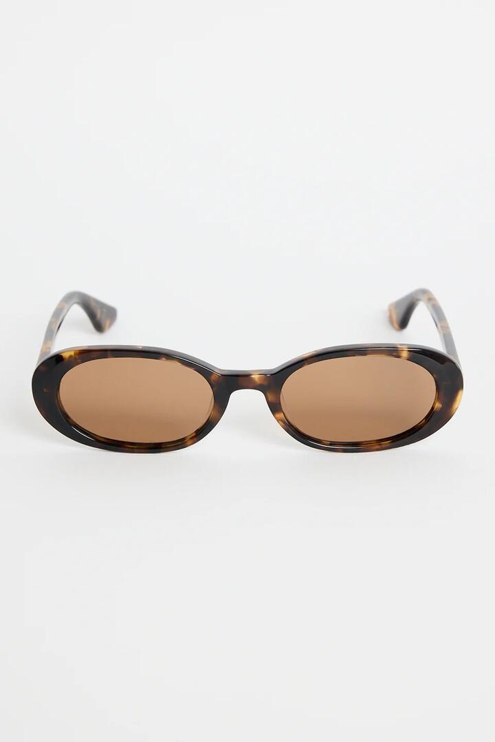 Image of Sunglasses. Product name - Sydney Tort Narrow Oval Sunglasses in colour by brand - RE:UNION Label