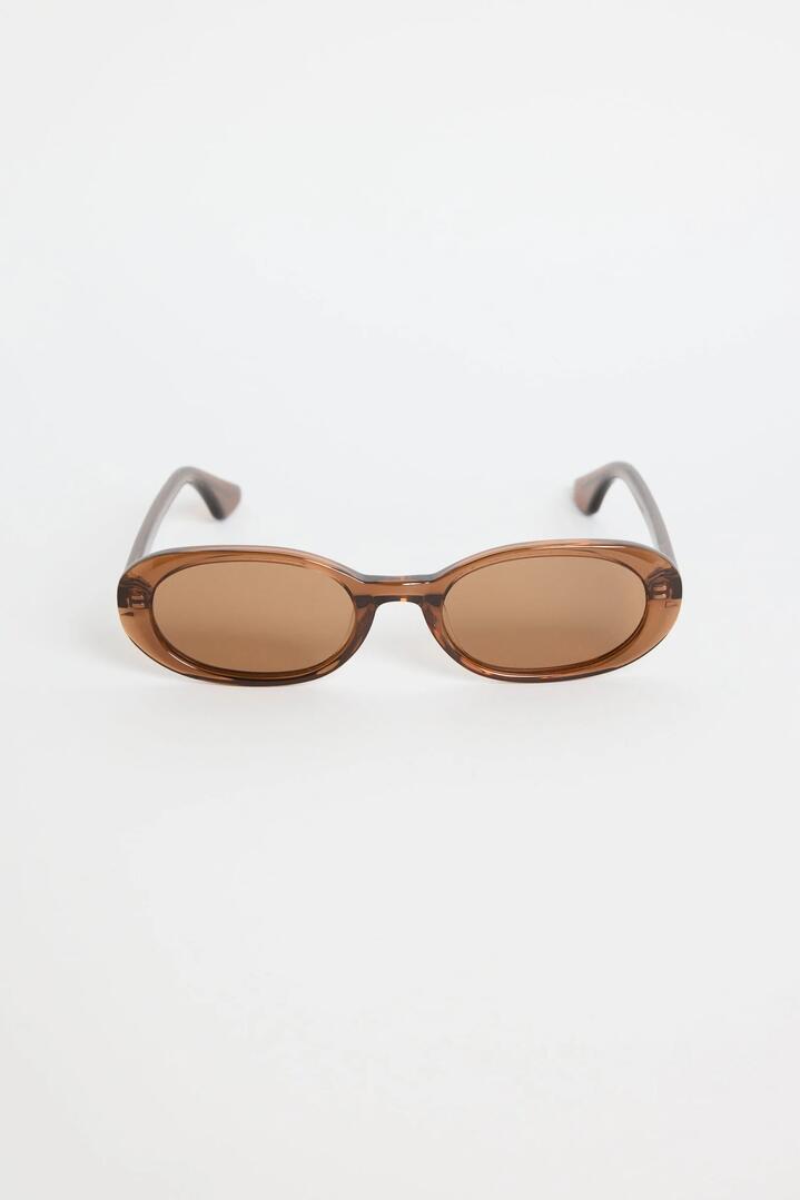 Image of Sunglasses. Product name - Sydney Espresso Narrow Oval Sunglasses in colour by brand - RE:UNION Label