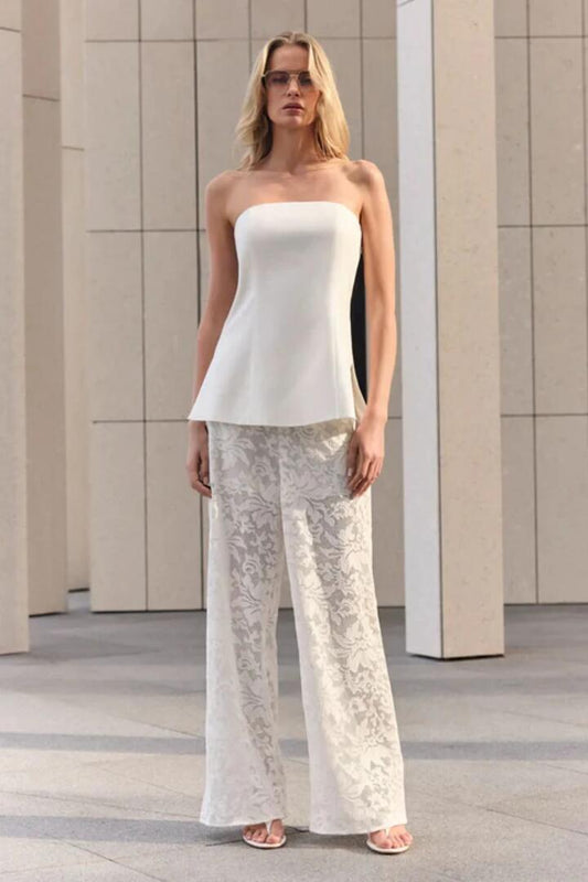 Image of a model wearing Tops. Product name - Marseille White Linen Bandeau Top in White colour by brand - Esmaee