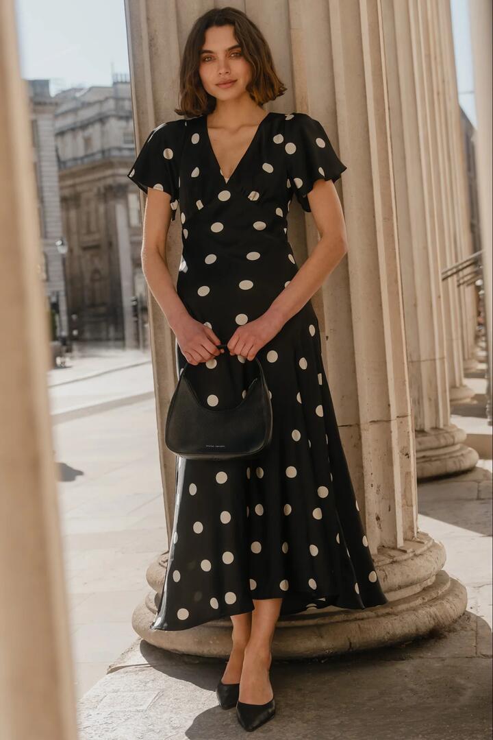 Image of Dresses. Product name - Chariot Black Polka Dot Bias Flutter Sleeve Maxi Dress in Black Polka Dot colour by brand - Among the Brave