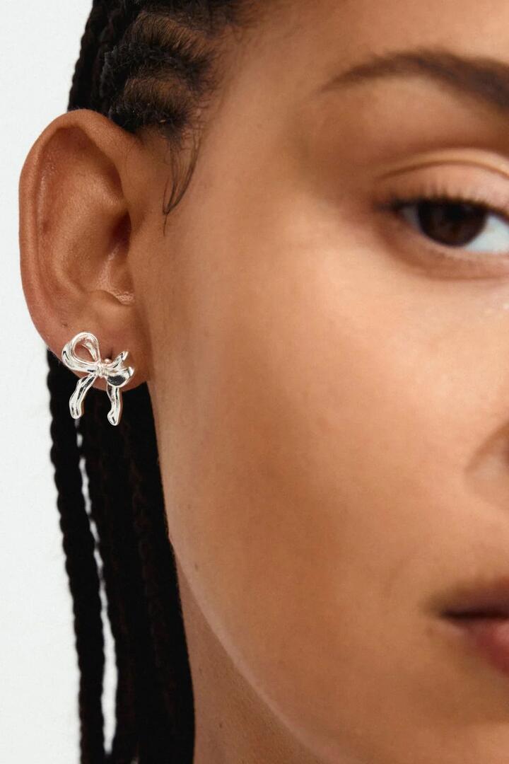 Image of Jewelry. Product name - Cassian Recycled Silver Plated Bow Stud Earrings in Silver colour by brand - Pilgrim