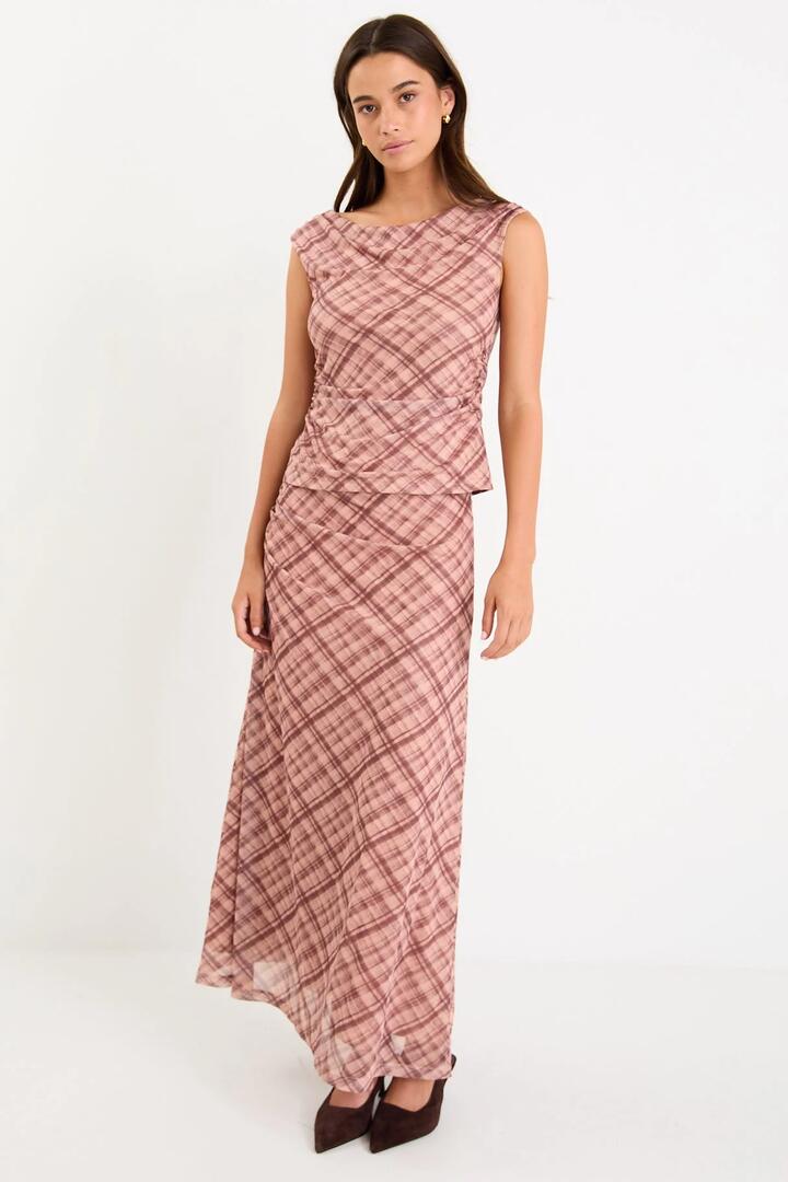 Image of a model wearing Skirts. Product name - Quench Blush Check Mesh Maxi Skirt in Blush Check Mesh colour by brand - Stories be Told