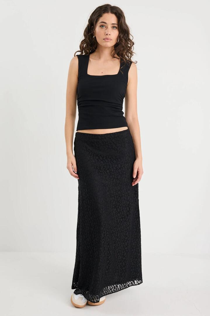 Image of a model wearing Skirts. Product name - Zeus Black Lace Bias Maxi Skirt in Black colour by brand - Stories be Told