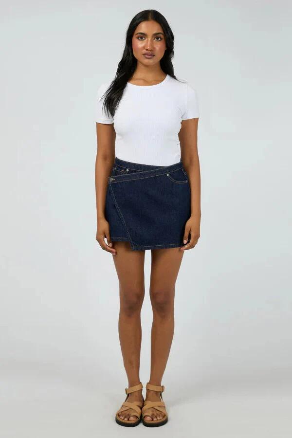 Image of a model wearing Skirts. Product name - Lenni Indigo Denim Mini Skort in Blue colour by brand - All About Eve