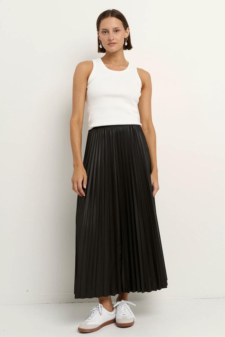 Image of a model wearing Skirts. Product name - Crystalised Black PU Pleated Midi Skirt in Black colour by brand - Among the Brave