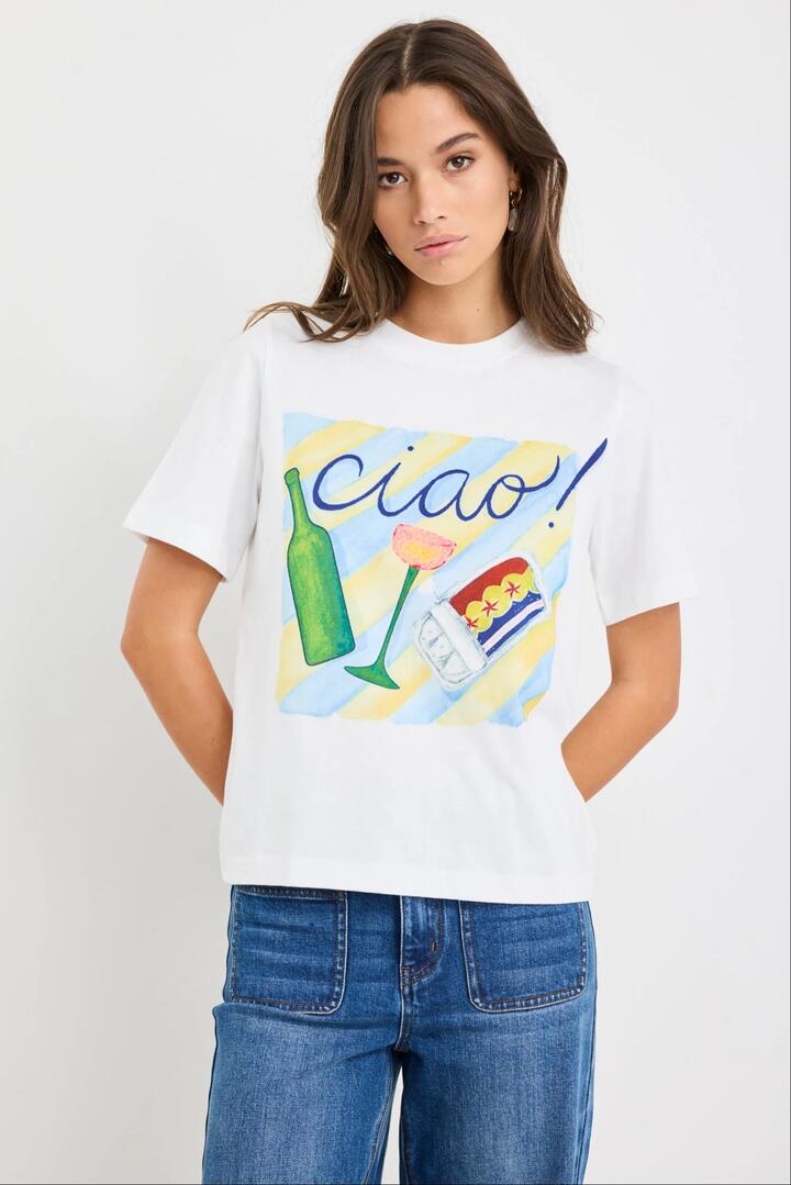 Image of a model wearing Tops. Product name - Paradiso Paradise Print Ivory Boxy Tee in Paradise Print colour by brand - Among the Brave