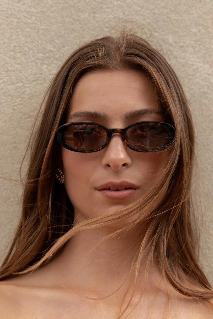 Image of Sunglasses. Product name - Havana Tort Narrow Oval Sunglasses in colour by brand - Among the Brave