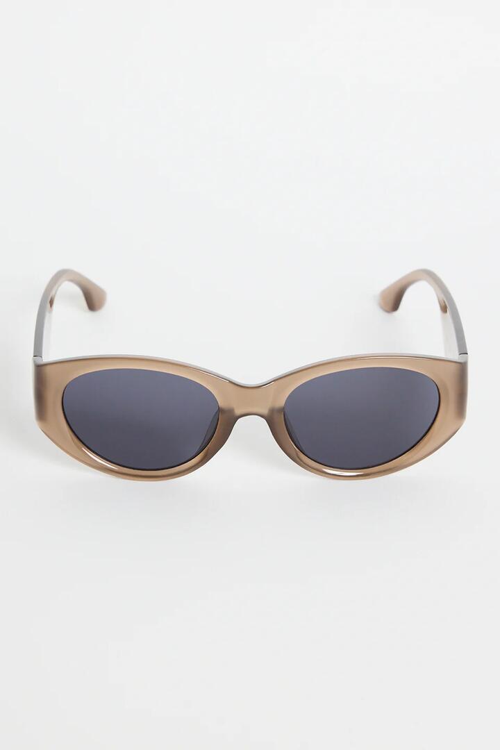 Image of Sunglasses. Product name - Tokyo Espresso Oval Sunglasses in colour by brand - Among the Brave