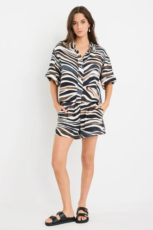 Image of a model wearing Shorts. Product name - Elaborate Chocolate Zebra Pull On Shorts in Chocolate Zebra colour by brand - Among the Brave