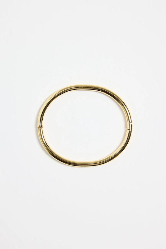 Image of Jewelry. Product name - Solid Round 14k Gold Plate Bangle in Gold colour by brand - Stories be Told
