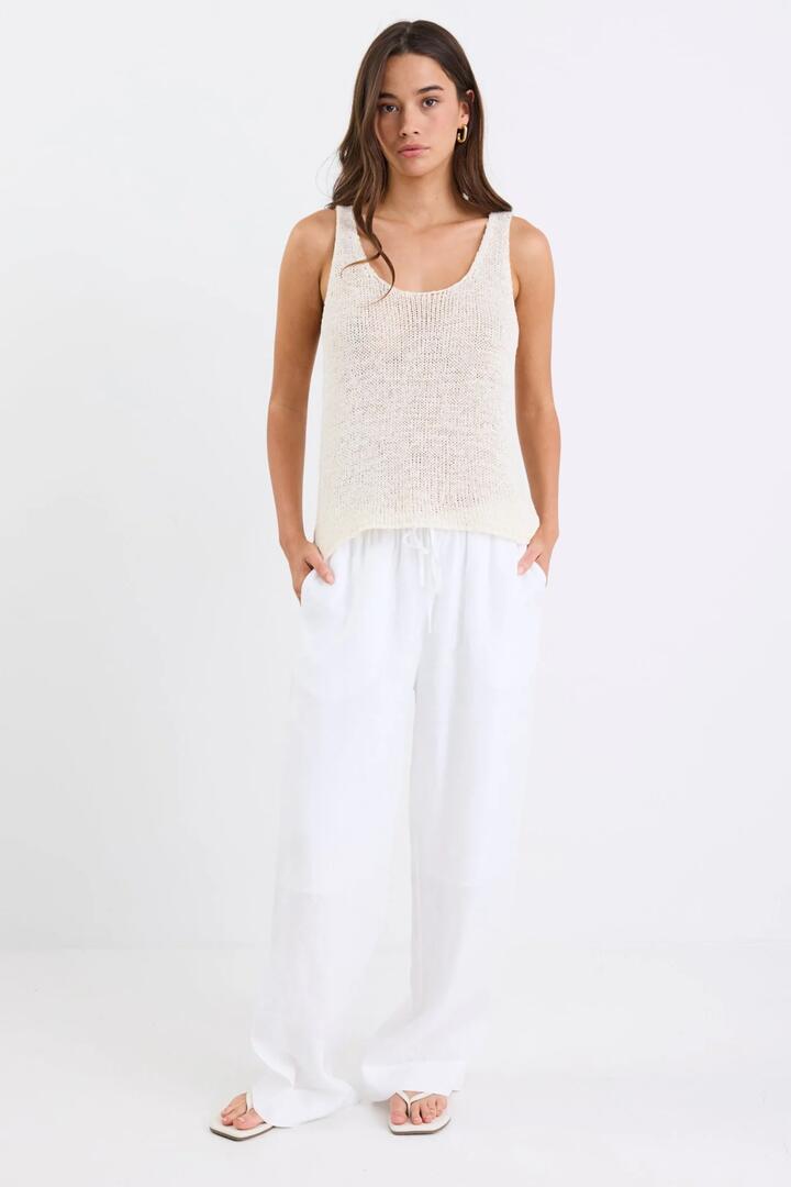 Image of a model wearing Pants. Product name - Wellness White Linen Pull On Wide Leg Pants in White Linen colour by brand - RE:UNION Label