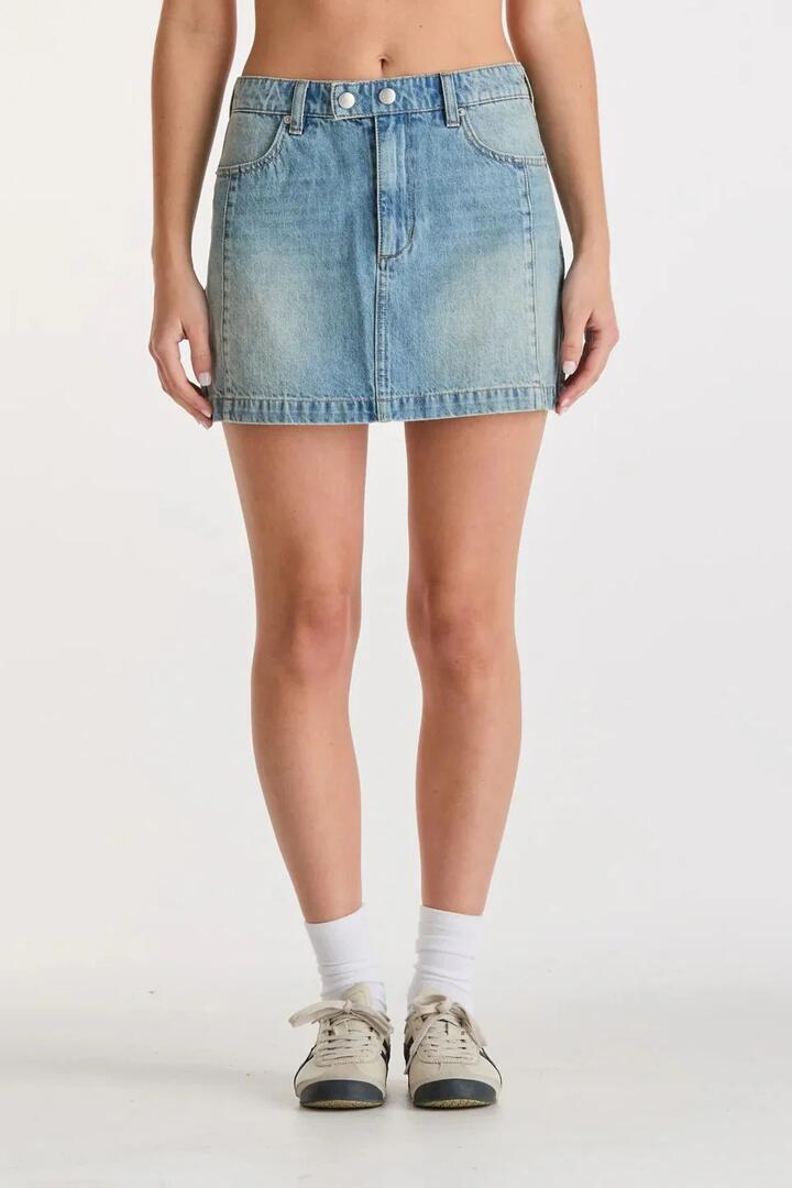 Image of a model wearing Skirts. Product name - Moto Gasoline Blue Organic Cotton Denim Mini Skirt in Blue colour by brand - Lee