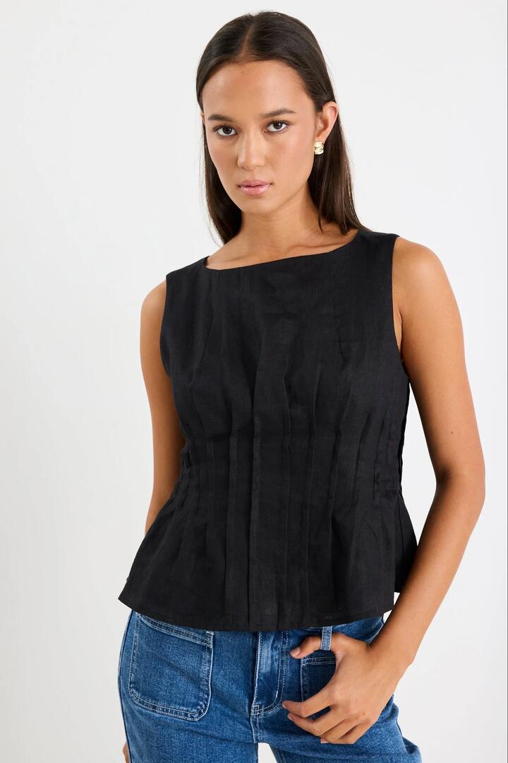 Image of a model wearing Tops. Product name - Inspiration Black Linen Pintuck Front Boatneck Top in Black Linen colour by brand - Stories be Told
