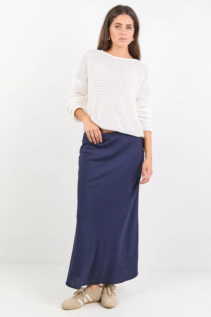 Image of a model wearing Skirts. Product name - Bliss Navy Linen Blend Bias Midi Skirt in Navy colour by brand - RE:UNION Label