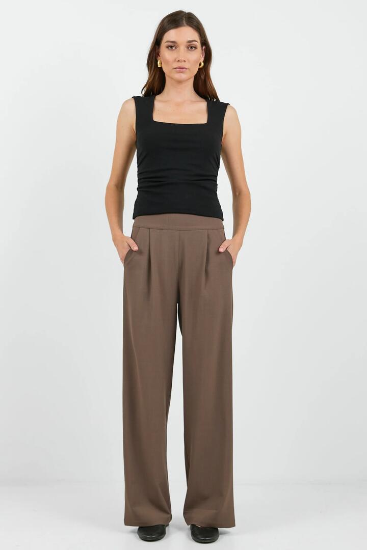 Image of a model wearing Pants. Product name - Instinctive Chocolate Twill Wide Leg Elastic Back Pants in Chocolate Twill colour by brand - Among the Brave