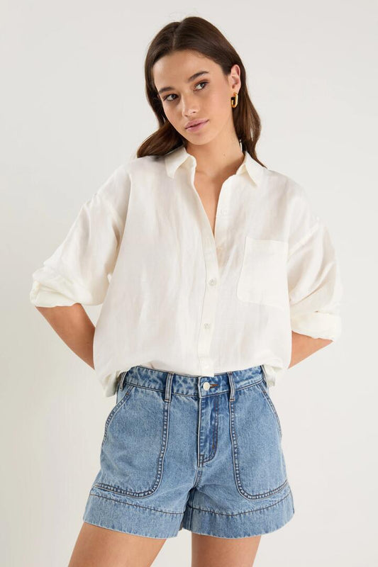 Image of a model wearing Shorts. Product name - Kindly Mid Blue Pocket Front Denim Shorts in Mid Blue colour by brand - Ivy + Jack